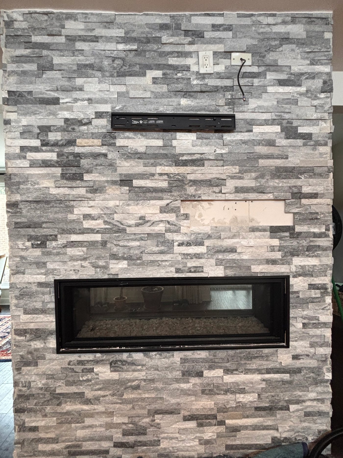 Rent A Husband project gallery photo: Fireplace tile before TV mount